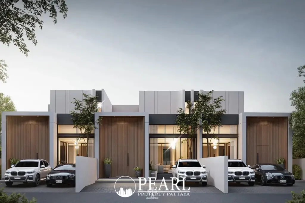 Asaya Pool Villa modern exterior with white and dark grey facades, large windows, wooden garage doors, and parked cars.