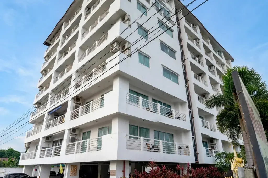 Jomtien Beach Mountain 2 private patio with terracotta tiles, outdoor seating, small pool, and lush garden.