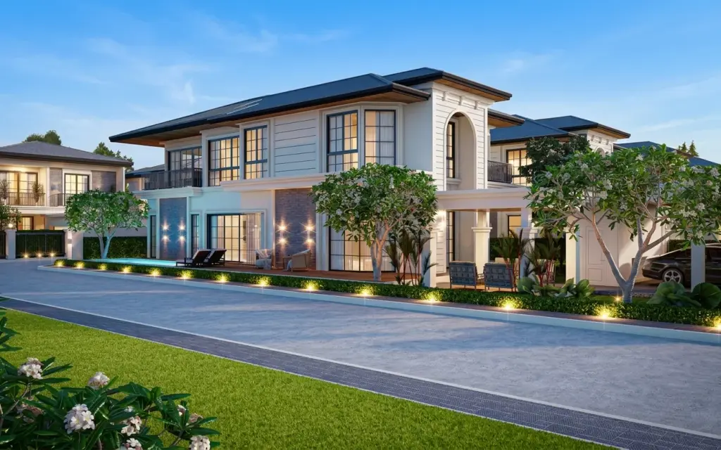Rungsii Village modern two-story house exterior with private pool, lounge chairs, and manicured landscaping at dusk.