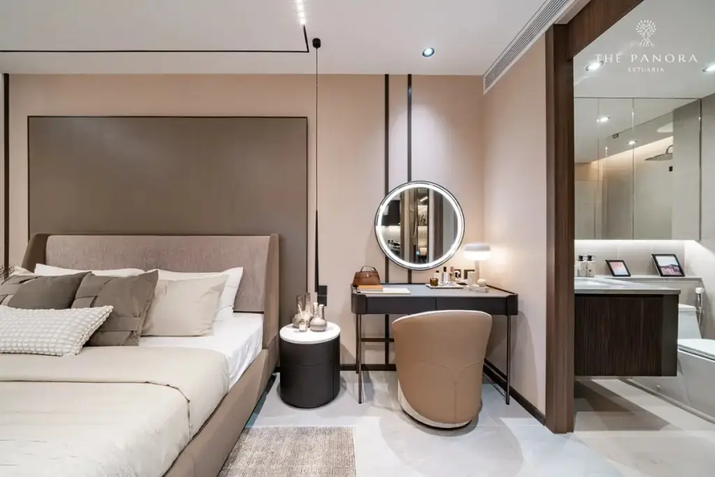 2 Bedroom Condo for Sale at Panora Estuaria master bedroom with upholstered headboard, wall-mounted TV, and walk-in closet