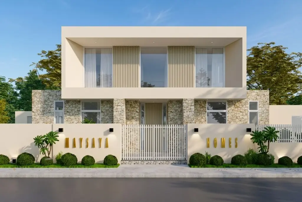 Maysaya Home, modern two-story house facade with stone cladding, white fence, and landscaped garden at dusk.