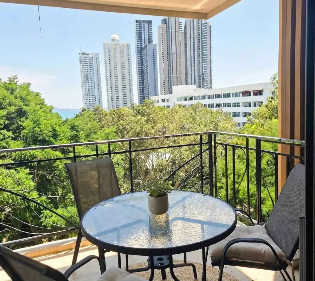 Studio Condo for Sale at City Garden Tropicana balcony seating area with high-rise and city skyline view