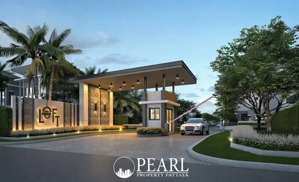 Baan Fah Greenery Loft entrance gate with modern canopy, security booth, a car, and illuminated 'LOFT' signage.