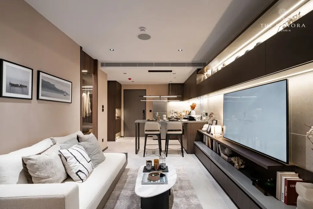 2 Bedroom Condo for Sale at Panora Estuaria master bedroom with wall-mounted TV, vanity desk and walk-in closet