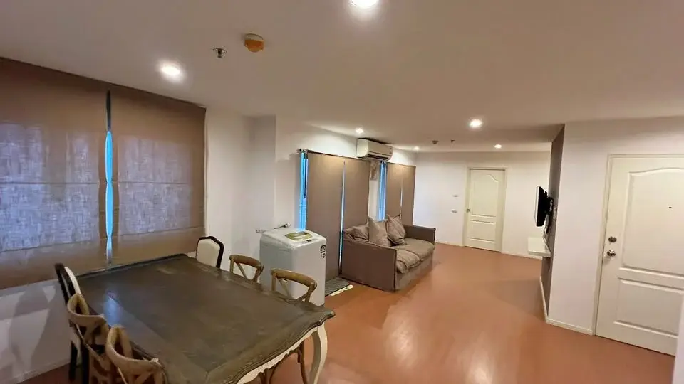 2 Bedroom Condo for Sale at Lumpini Condo Town North Pattaya-Sukhumvit open living area with dining table and sofa