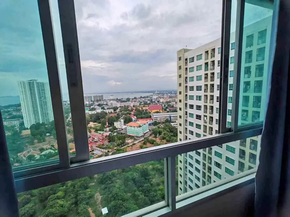 1 Bedroom Condo for Rent at Lumpini Ville Naklua-Wongamat high-rise window view of Pattaya city skyline and sea