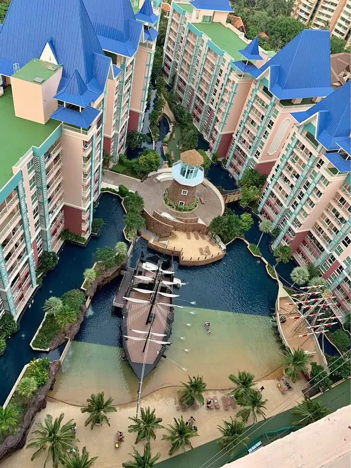 1 Bedroom Condo for Sale at Grande Caribbean aerial view of pirate ship pool and lagoon-style canals