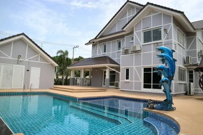 Central Park Hillside modern house exterior with swimming pool, covered patio, and outdoor seating area.