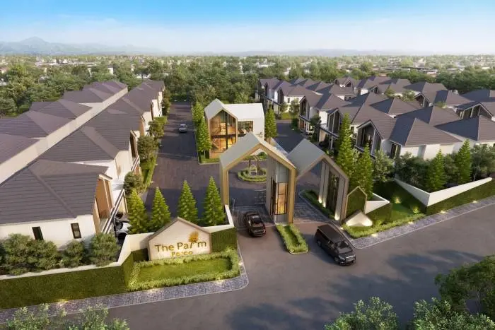 The Palm Parco: Aerial view of the modern housing development entrance, rows of houses, and green landscaping.