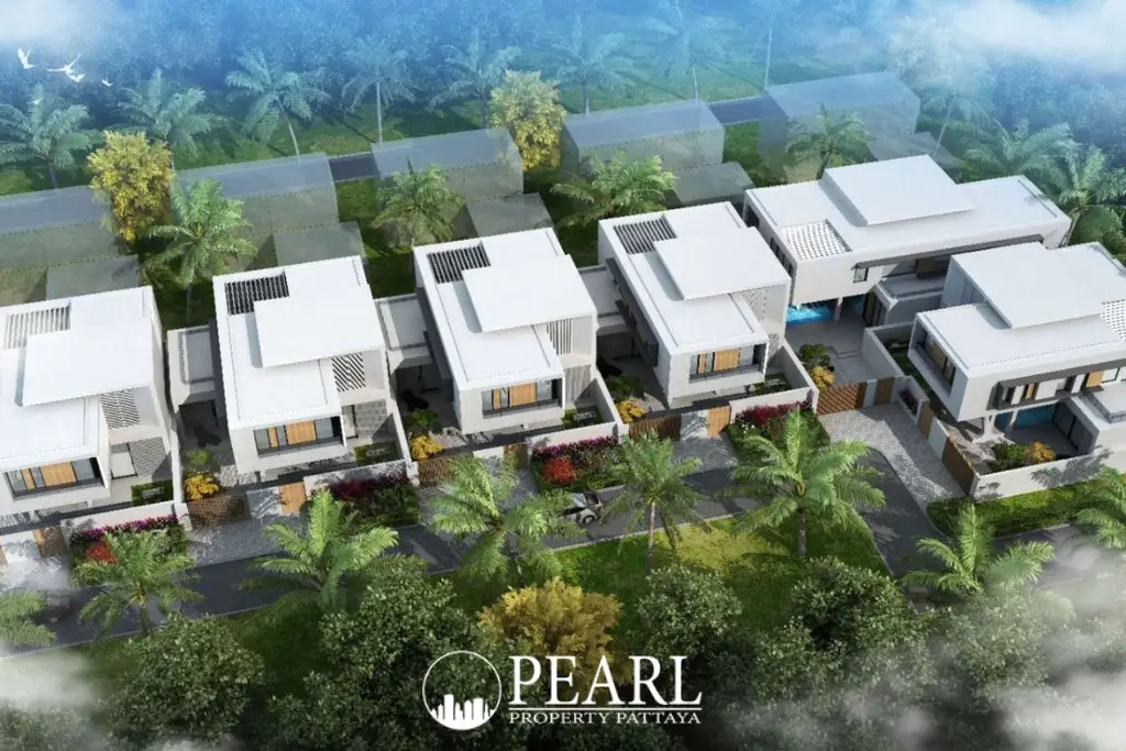 Young Life Villa aerial view of modern villa complex with palm trees and green landscaping.