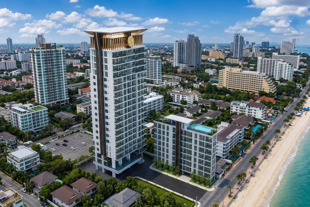 Sea Sky condo tower exterior at sunset with Pattaya beachfront and city skyline in background