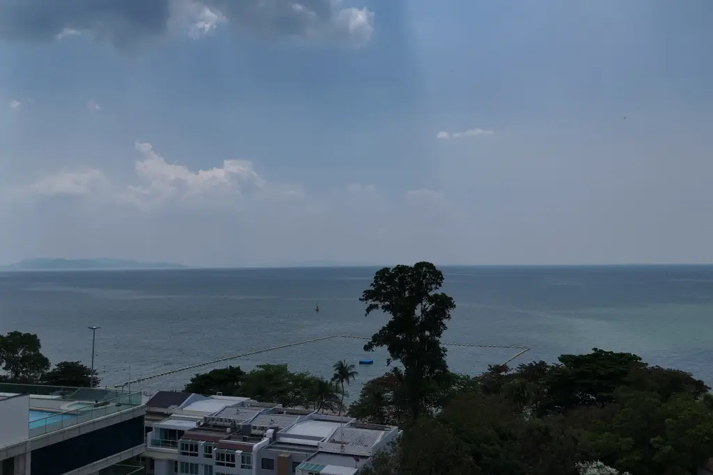 1 Bedroom Condo for Sale at Sea Sky By Sand ocean view from balcony with rooftop pool and coastline