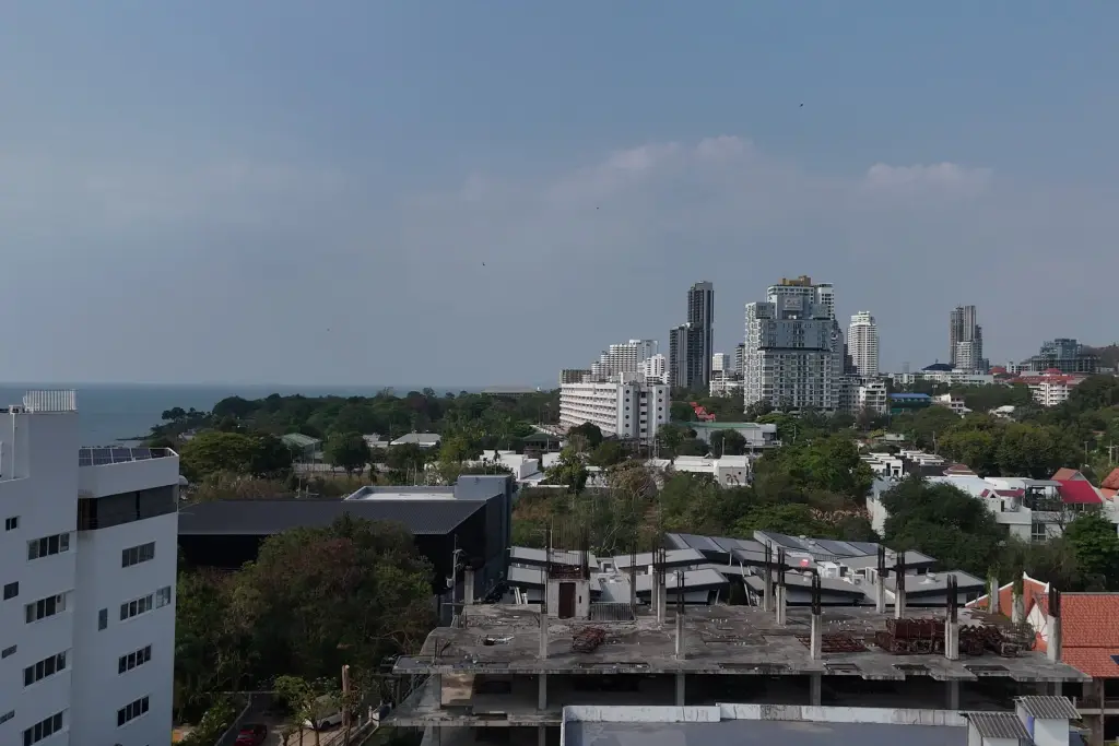1 Bedroom Condo for Sale at Sea Sky By Sand rooftop view of Pattaya skyline and coastline from upper floor