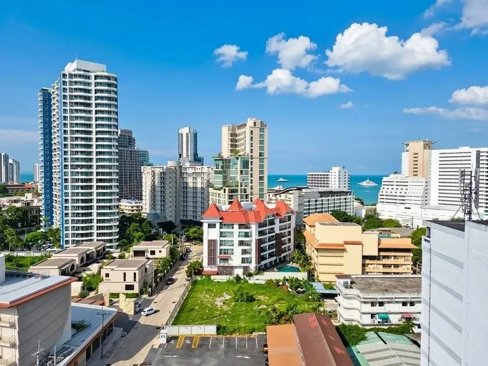 1 Bedroom Condo for Sale at Sky Residences Pattaya aerial view of city skyline and ocean from high floor