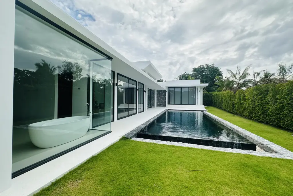2 Bedroom House for Sale at Sunplay Bangsaray modern exterior with freestanding bathtub, black-tiled pool and lawn