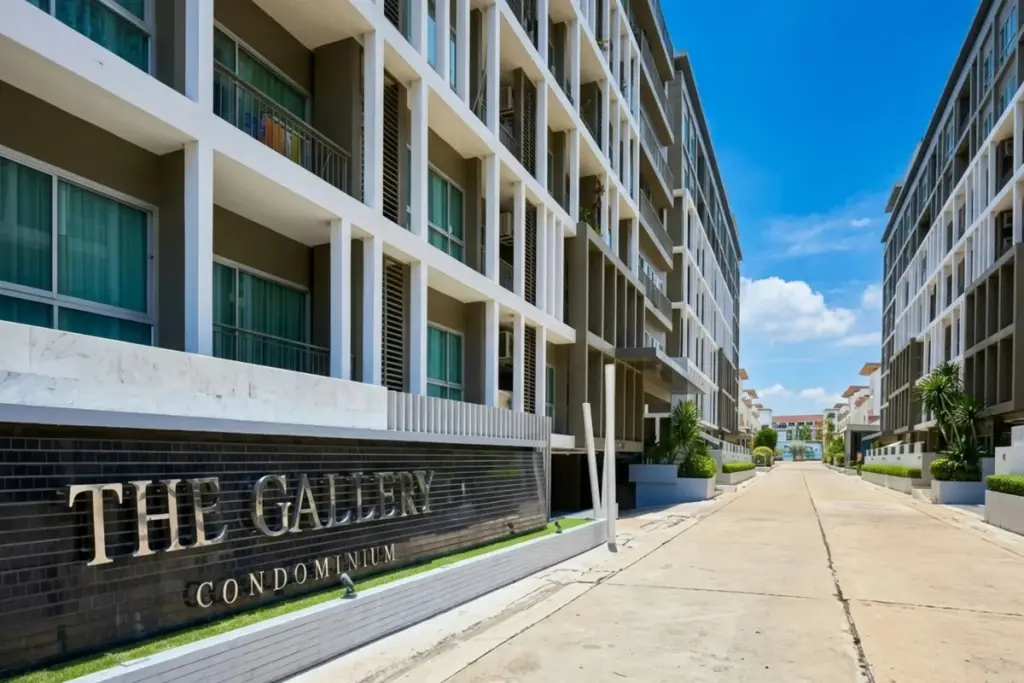 The Gallery Condominium, aerial view of modern buildings with rooftop swimming pools, lounge areas, and distant ocean.