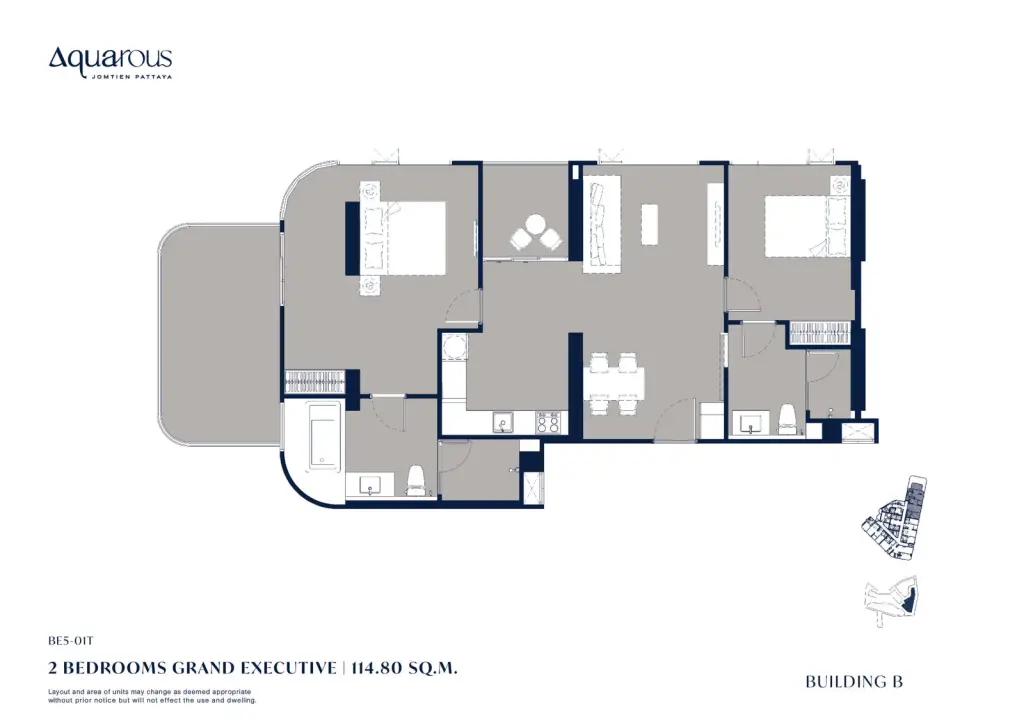 2 Bedroom Condo for Sale at Aquarous Jomtien Pattaya spacious living room with dark sofa, round coffee table, large abstract artwork and floor-to-ceiling curtains