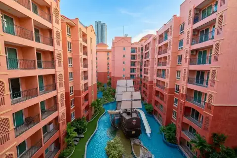 Seven Seas Condo Resort pirate ship water slide in winding pool courtyard at sunset