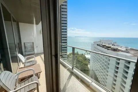 1 Bedroom Condo for Rent at Northpoint private balcony with seating and glass railing overlooking the sea