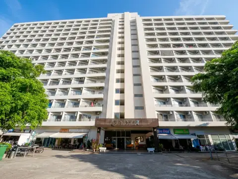 View Talay 1 condo building facade with balconies, ground-floor shops, and entrance