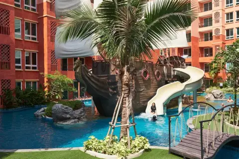 Seven Seas Condo Resort pirate ship themed pool slide with children playing in the lagoon pool