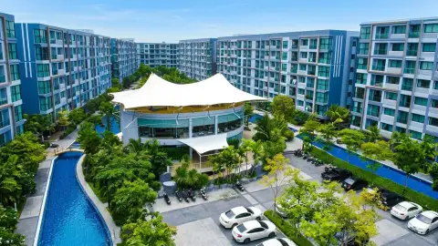 Dusit Grand Park 1 aerial view of clubhouse with tensile roof, pool and parking area