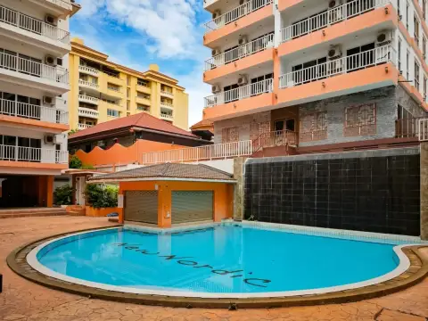 New Nordic Trend 2 condo pool surrounded by orange and white residential buildings