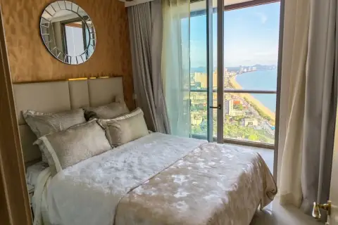 1 Bedroom Condo for Rent at Copacabana Beach Jomtien bedroom with round mirror and panoramic sea view