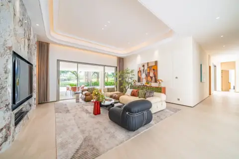 6 Bedroom House for Sale in Huai Yai spacious living room with marble TV wall tray ceiling and garden view