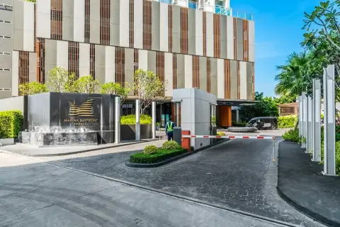 Marina Bayfront Sriracha entrance driveway with security gate and signage