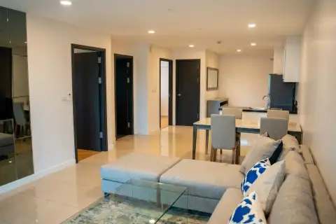 2 Bedroom Condo for Sale at The Elegance spacious living and dining area with tiled floors and dark bedroom doors