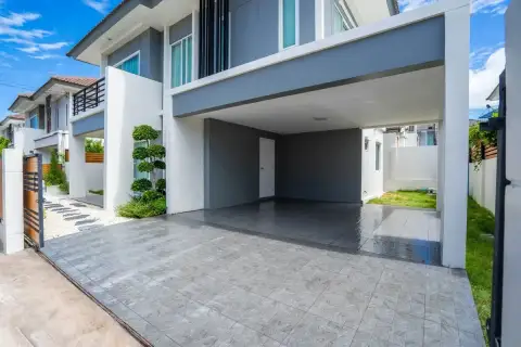 3 Bedroom House for Sale at Baan Pruksa Nara Chaiyapruek spacious covered carport with tiled driveway and landscaped entrance