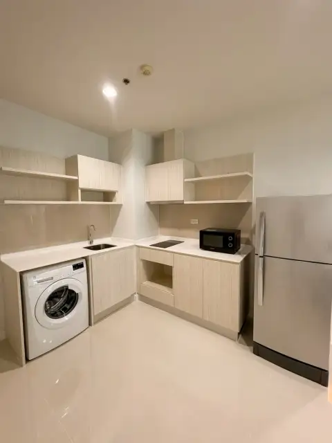 2 Bedroom Condo for Sale at Centric Sea kitchen with washing machine, fridge, and microwave