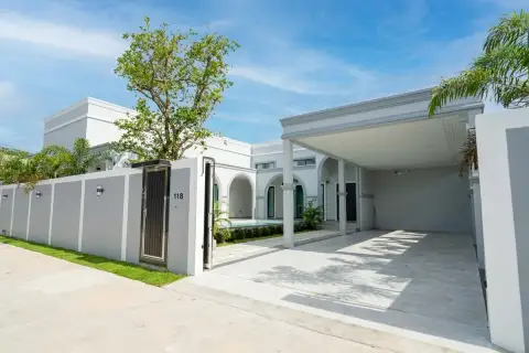 4 Bedroom House for Sale in Nong Prue white exterior front view with gated entrance and covered carport