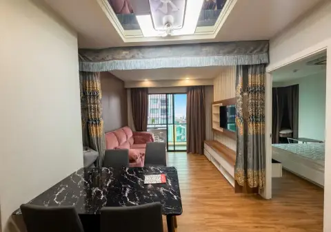2 Bedroom Condo for Sale at Dusit Grand Park 1 open-plan dining and living area with marble table and city view