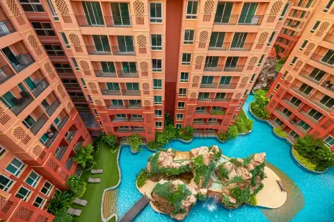 Seven Seas Condo Resort elevated view of lagoon pool with rock waterfall feature between condo buildings