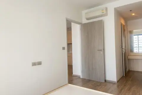 1 Bedroom Condo for Sale at Aeras hallway with bedroom door and air conditioning unit