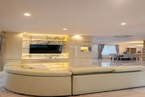 4 Bedroom House for Sale at Paradise Villa 1 & 2 open-plan living and dining area with marble TV feature wall and curved sofa