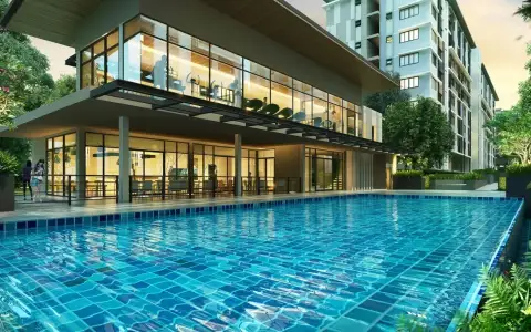 G Condo Sriracha clubhouse with glass-walled lounge and fitness area beside tiled swimming pool