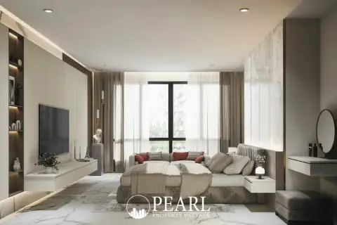 2 Bedroom Condo for Sale at Avenue Boutique Pattaya bedroom with walk-in closet and wall-mounted television