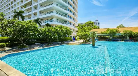 View Talay 5D poolside view with frangipani trees, clubhouse and condo tower
