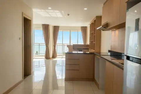 3 Bedroom Condo for Sale at Whale Marina kitchen and dining area with wooden cabinetry, island counter and balcony sea view