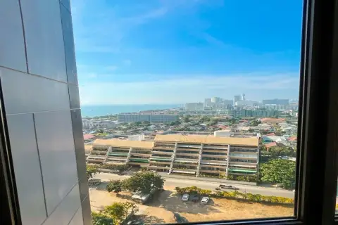 1 Bedroom Condo for Rent at Copacabana Beach Jomtien high-floor window view of Jomtien cityscape and ocean