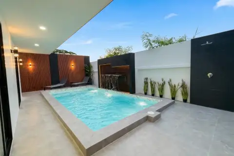 5 Bedroom House for Rent at View Point Village private pool with waterfall feature and lounge chairs