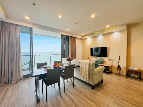 2 Bedroom Condo for Sale at Baan Plai Haad living and dining area with sea view balcony