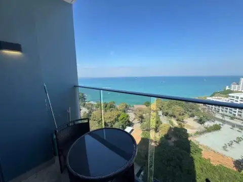 1 Bedroom Condo for Sale at Andromeda Condominium private balcony with rattan table overlooking the ocean