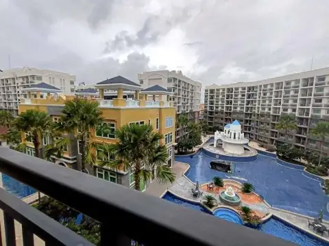 2 Bedroom Condo for Rent at Arcadia Beach Continental balcony view overlooking pool and palm-lined courtyard