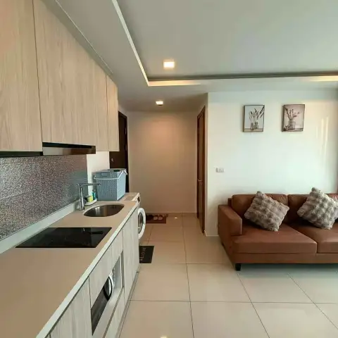 2 Bedroom Condo for Rent at Arcadia Beach Resort hallway view from kitchen counter to living room sofa
