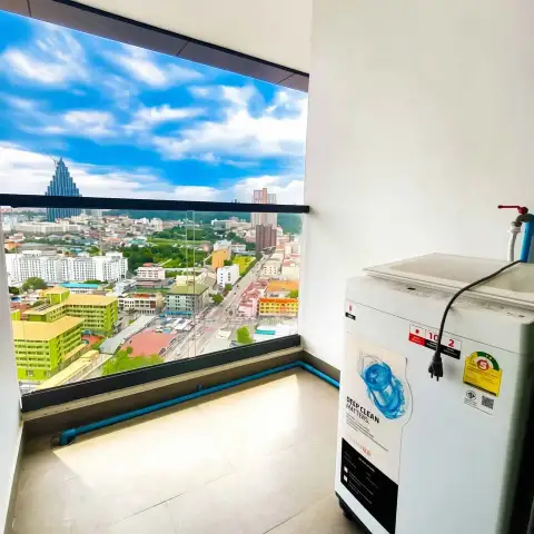 1 Bedroom Condo for Sale at Arcadia Millennium Tower balcony view of city skyline with washing machine on terrace