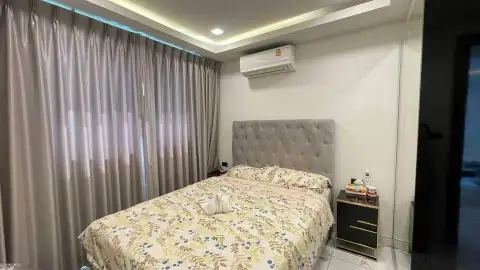 2 Bedroom Condo for Sale at Arcadia Millennium Tower bedroom with curtained window, air conditioner and nightstand